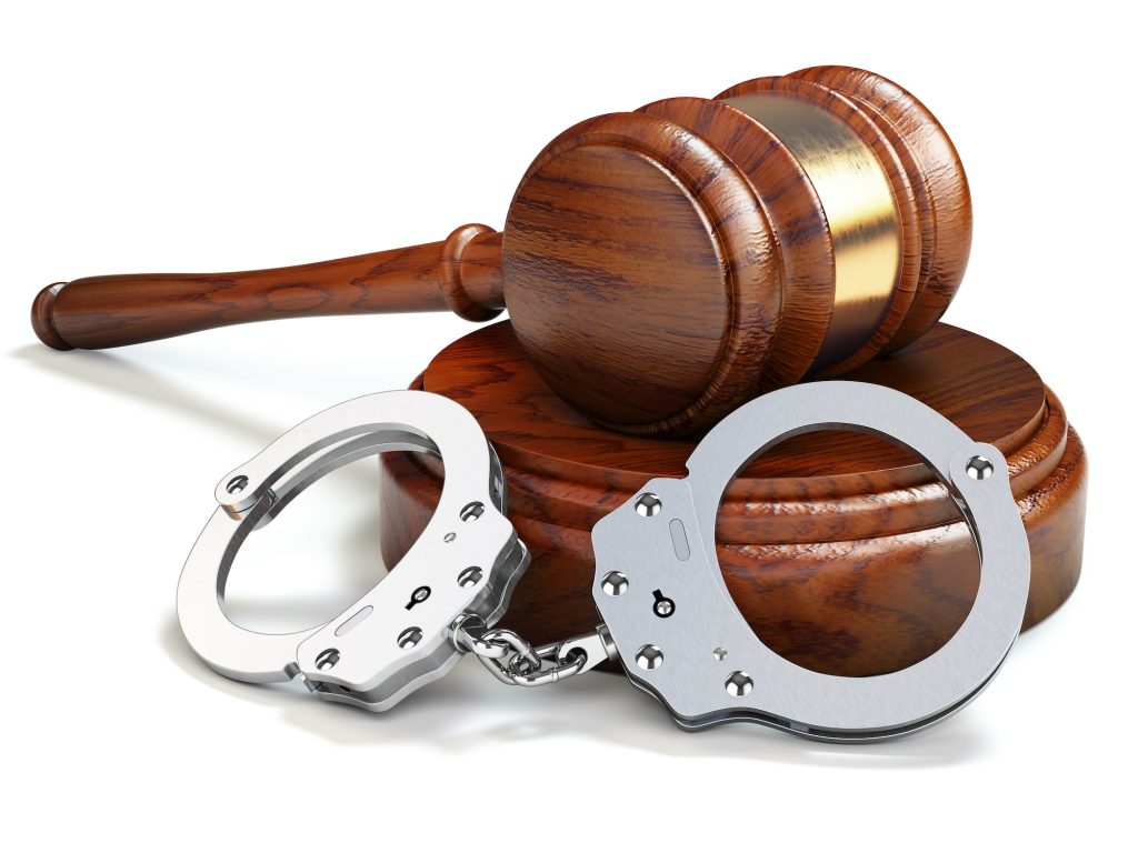 Gavel and handcuffs isolated oin white background. Law and justi